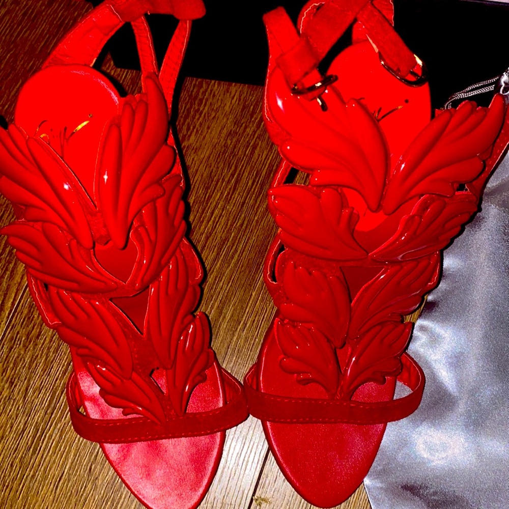 Red heels with wings.